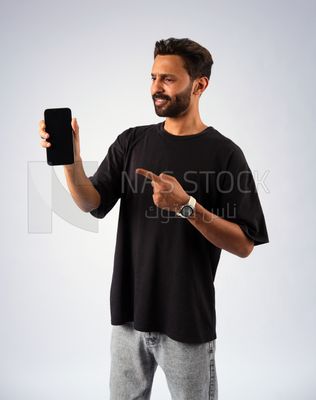 Guy in youth clothes and holding a mobile
