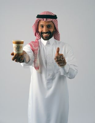 Gulf man with hot drink