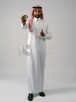 Gulf man with hot drink
