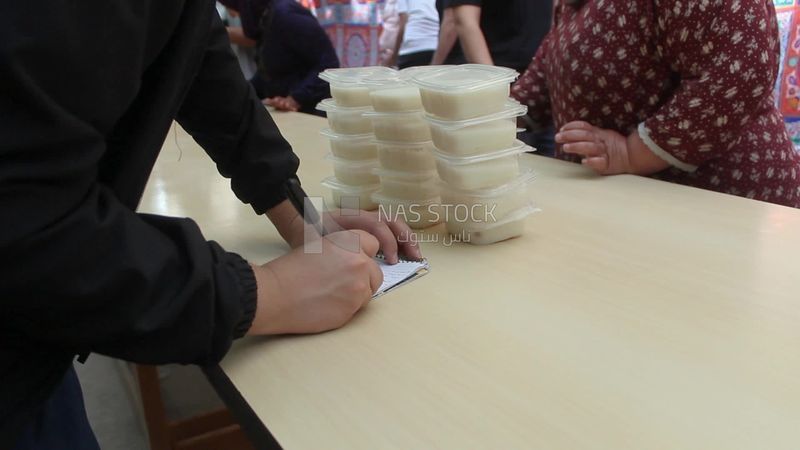 People prepare sweets to distribute for iftar,  Ramadan Kareem, preparing their iftar