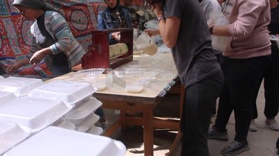 View of people in Matareya sharing their iftar together in the street, Ramadan Kareem, preparing their iftar