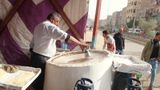 Man making handmade Kunafa in store, Ramadan sweets, Ramadan Kareem