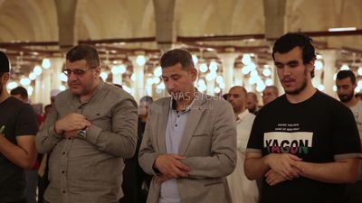 Worshipers praying in a mosque