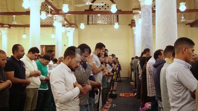 Worshipers praying in a mosque