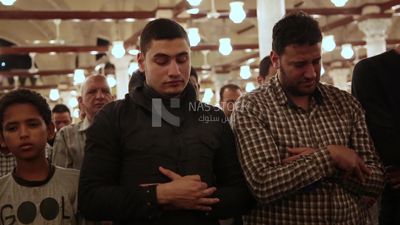 Worshipers praying in a mosque