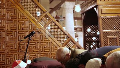 Worshipers praying in a mosque