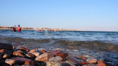 Waves hit the rocks on the seashore in a stunning view