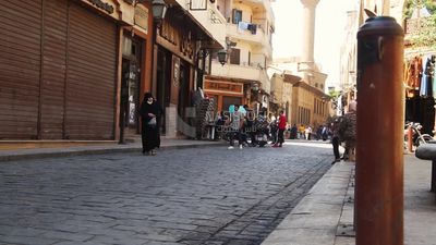 Group of people walking in el moez street