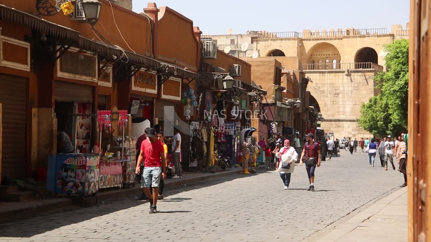 Group of people walking in el moez street