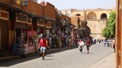 Group of people walking in el moez street