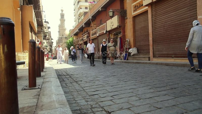 Group of people walking in El moez street