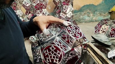 People working at a workshop to make ramadan lanterns