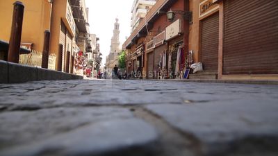 Group of people walking in el moez street