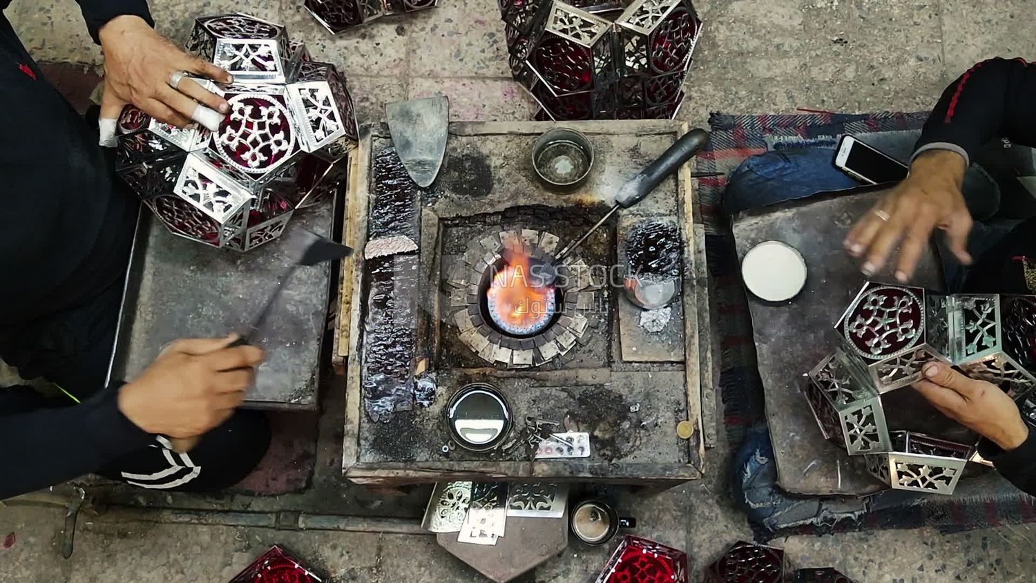 People working at a workshop to make ramadan lanterns