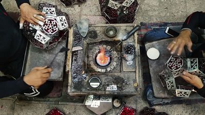 People working at a workshop to make ramadan lanterns