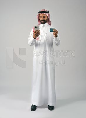 Gulf man holding phone and bank card