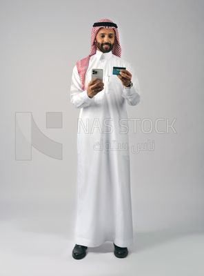 Gulf man holding phone and bank card