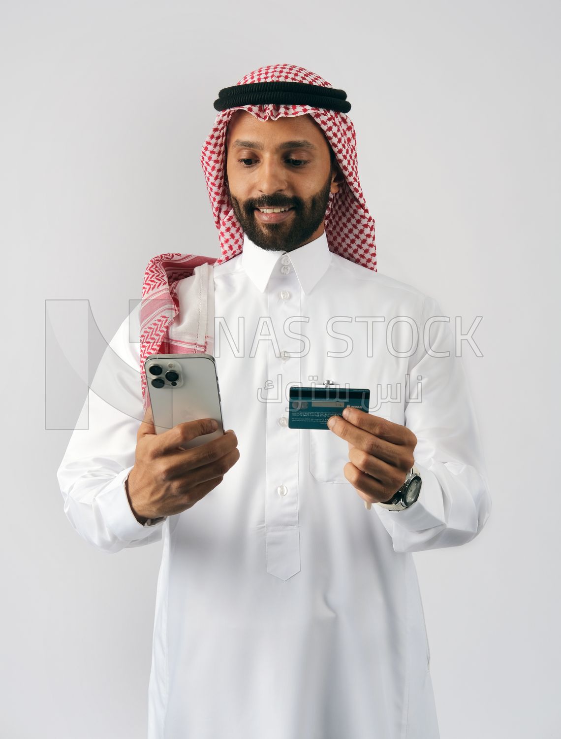 Gulf man holding phone and bank card