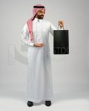 Gulf man holding a shopping bag