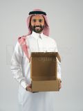 Gulf man holding a  cardboard box