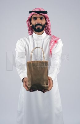 Gulf man holding a Paper bag