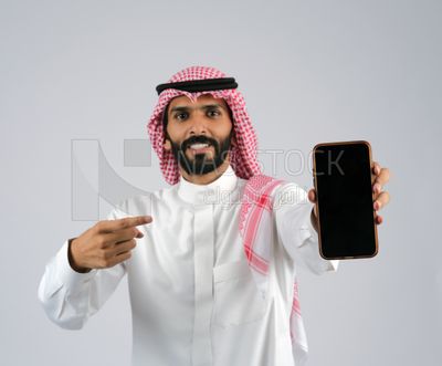 Gulf man holding a Mobile phone