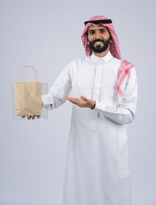 Gulf man holding a Paper bag