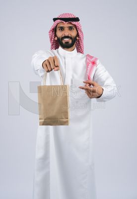 Gulf man holding a Paper bag
