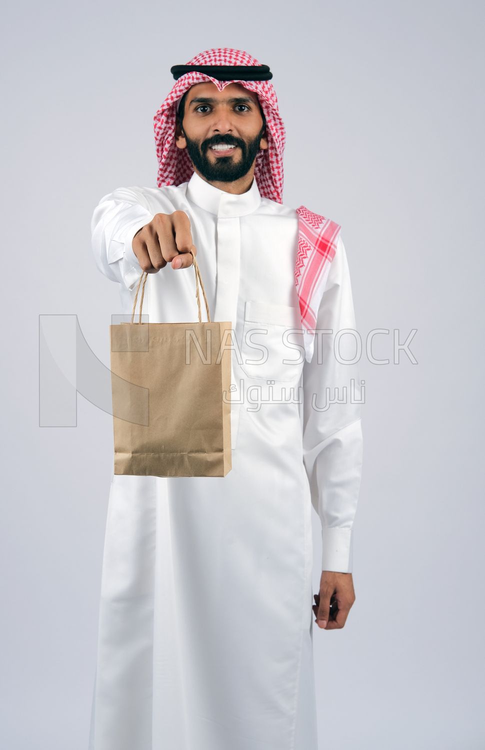 Gulf man holding a Paper bag