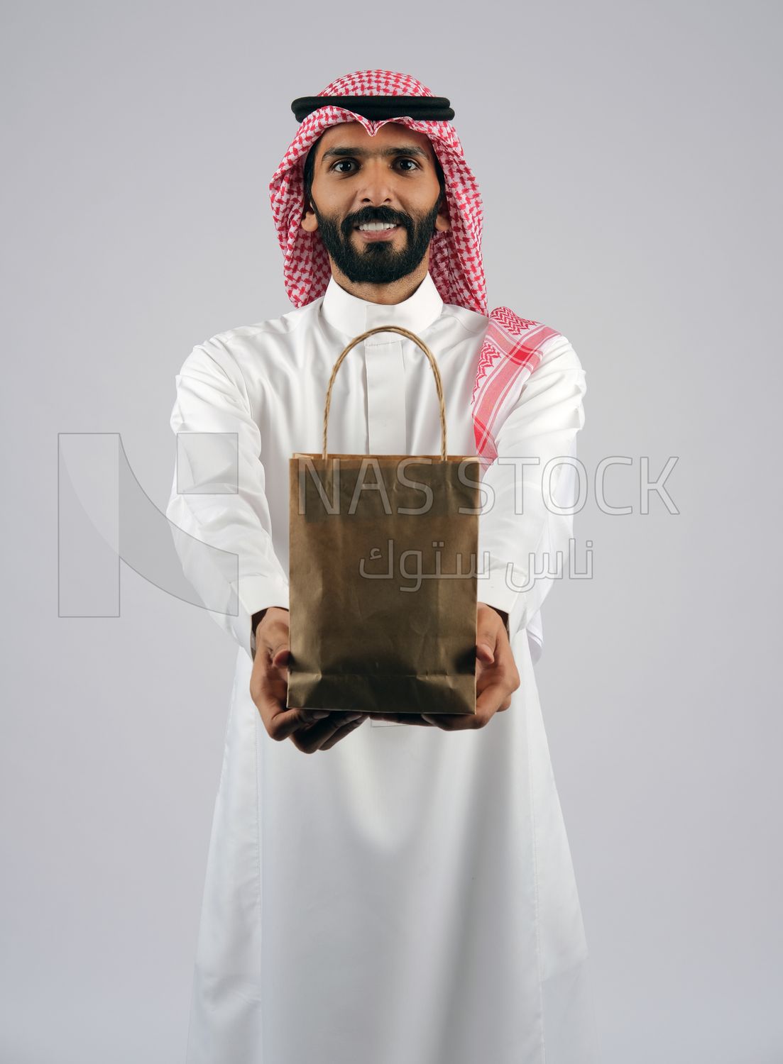 Gulf man holding a Paper bag