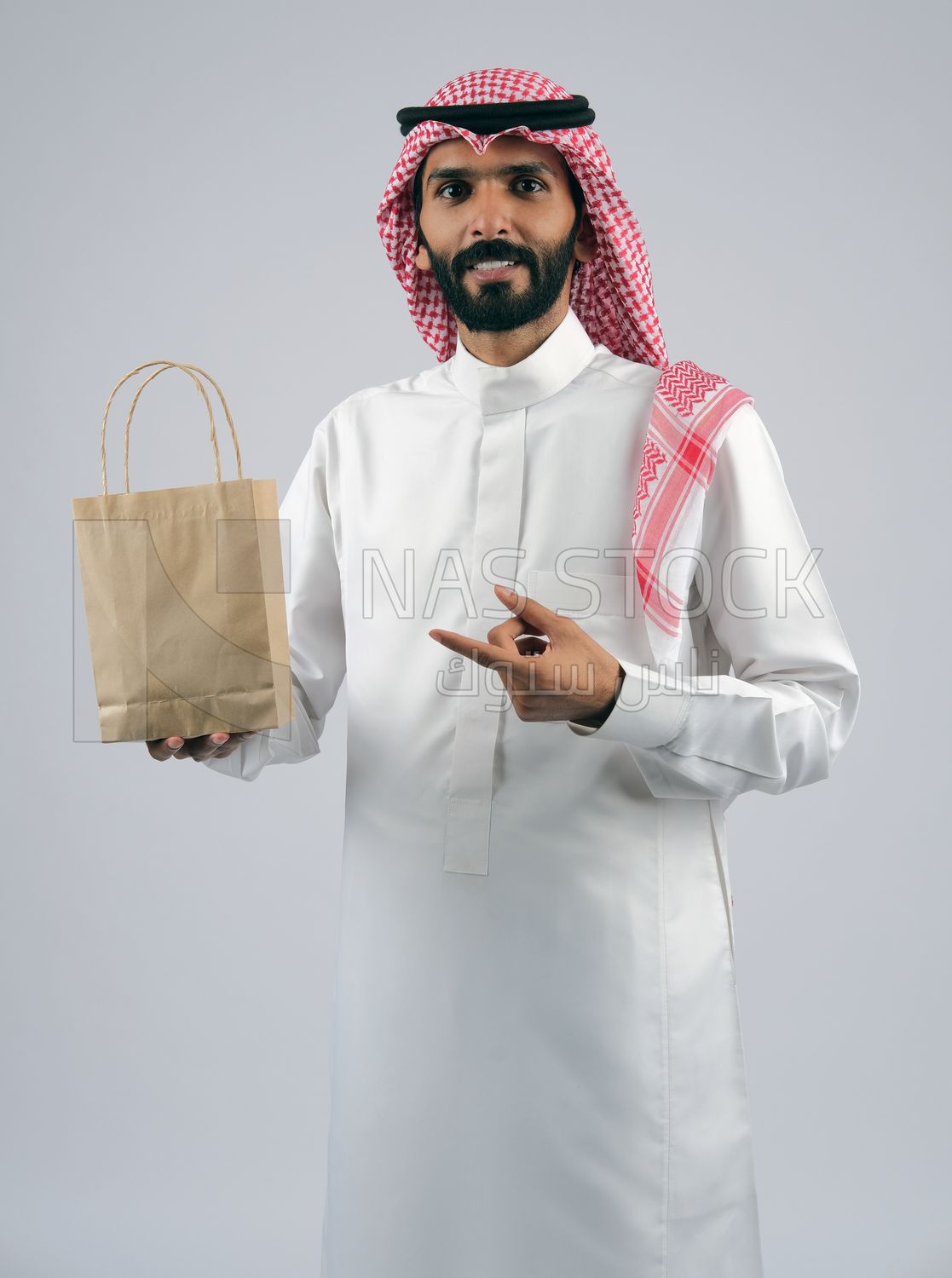 Gulf man holding a Paper bag