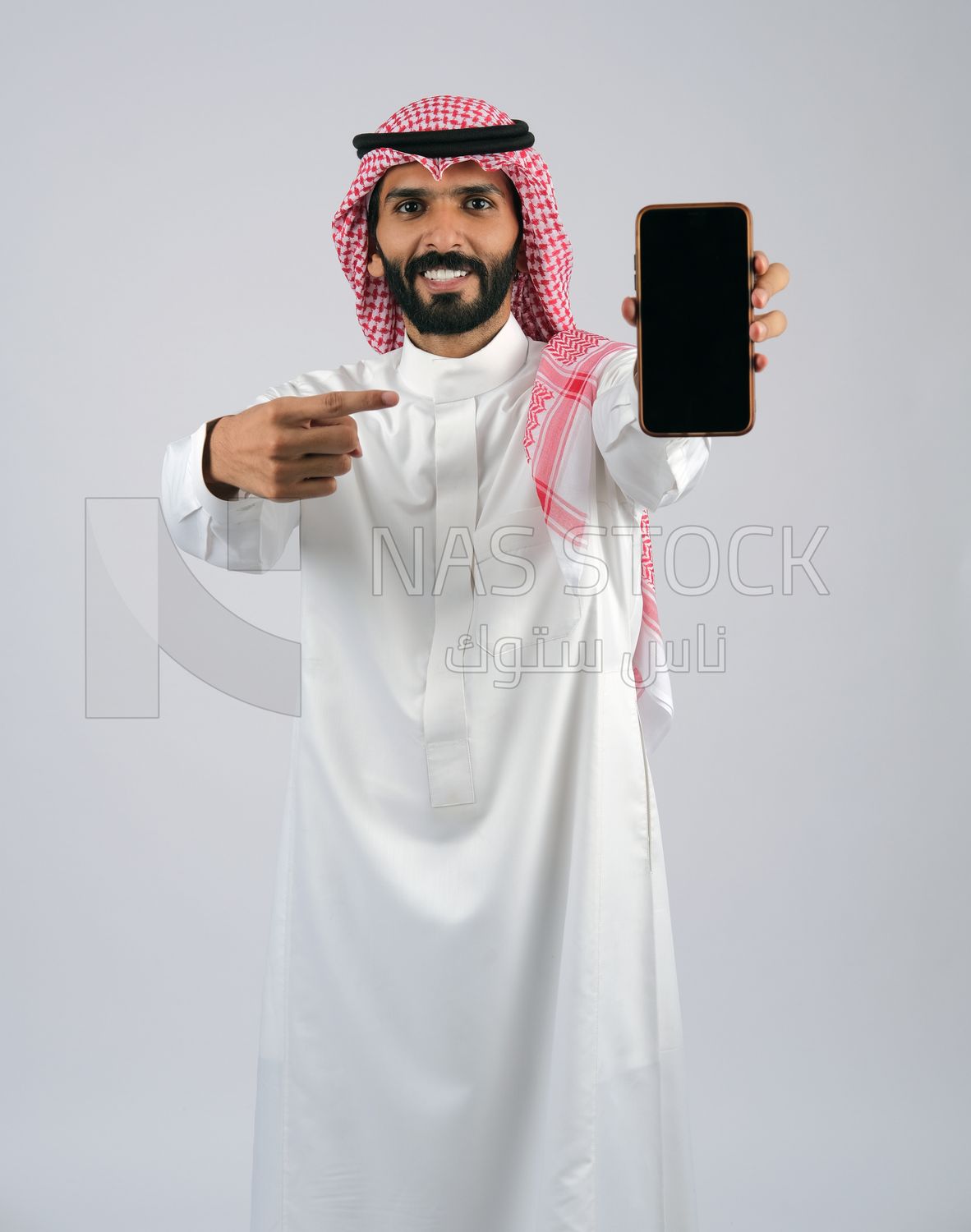 Gulf man holding a Mobile phone