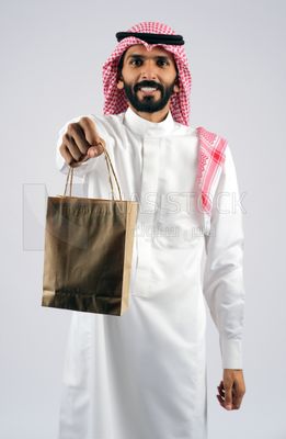 Gulf man holding a Paper bag