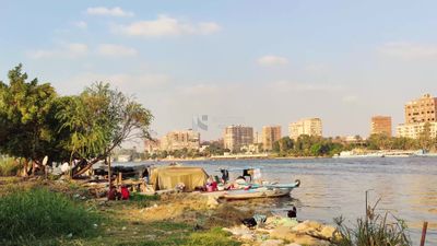 Covered feluccas moored on the bank of the Nile