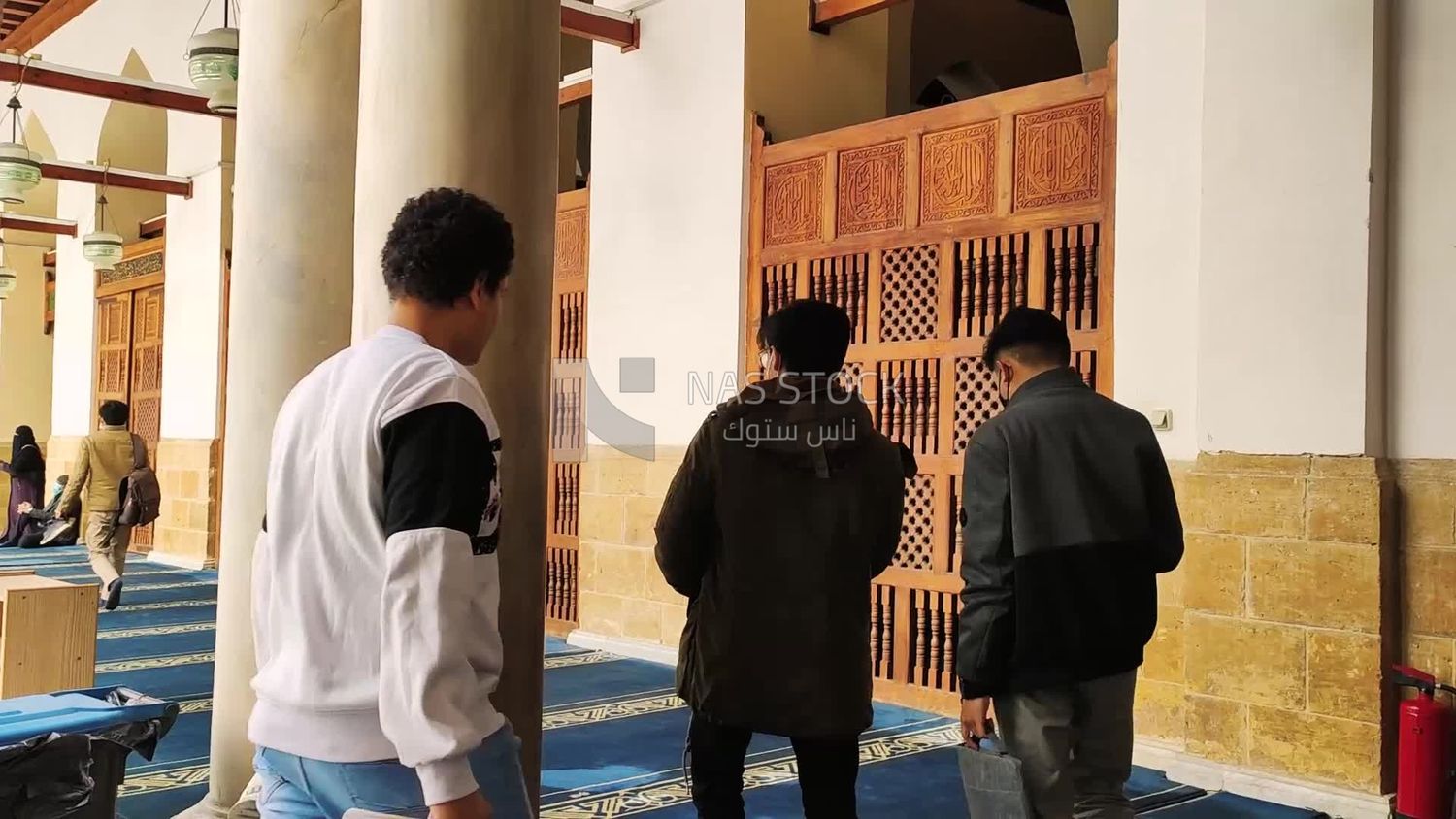 Visitors wandering inside Al-Azhar Mosque