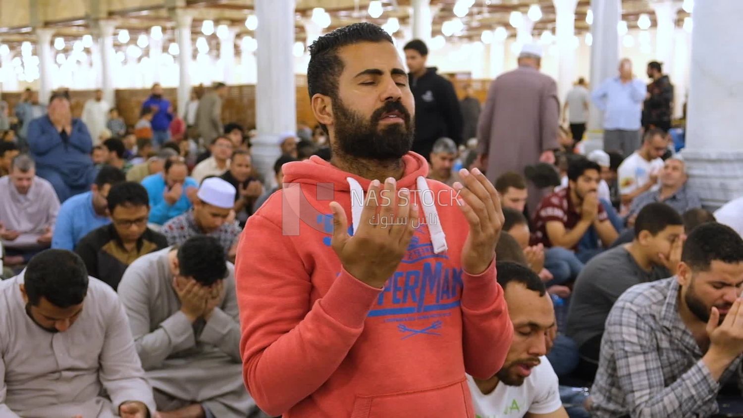 Man in the mosque, praying to God, praying on the prayer rug, performing the obligatory prayer in the mosque, worship and draw close to God