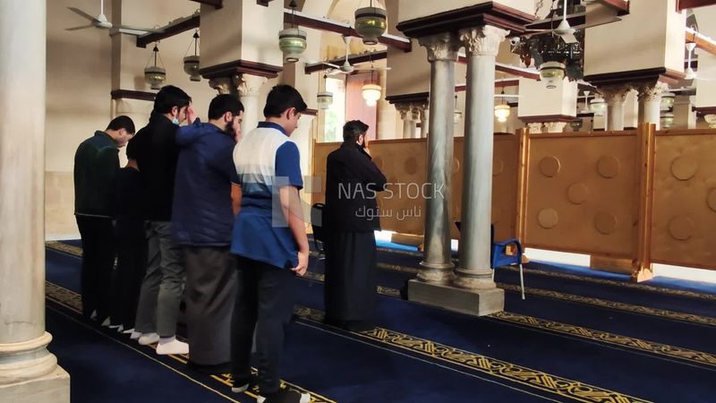 Muslims praying inside Al-Azhar Mosque