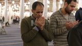 Man in the mosque, praying to God, praying on the prayer rug, performing the obligatory prayer in the mosque, worship and draw close to God