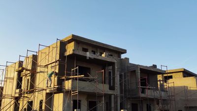 One of the buildings after the completion of its construction and then finishing for painting on it