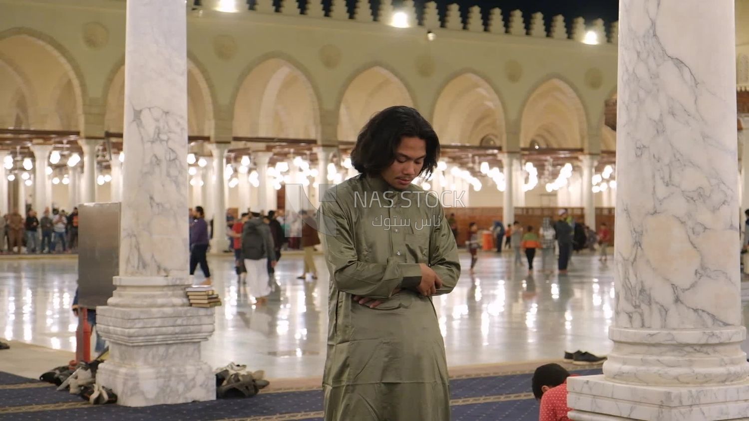 Man in the mosque, praying to God, praying on the prayer rug, performing the obligatory prayer in the mosque, worship and draw close to God