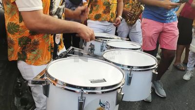 Young man plays drums in the street