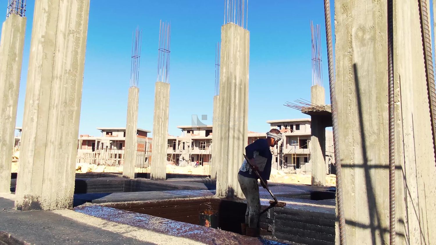 Worker paints the structure with an anti-rust material to protect the concrete from corrosion