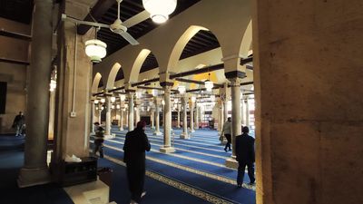 Group of men and visitors inside Al-Azhar Mosque