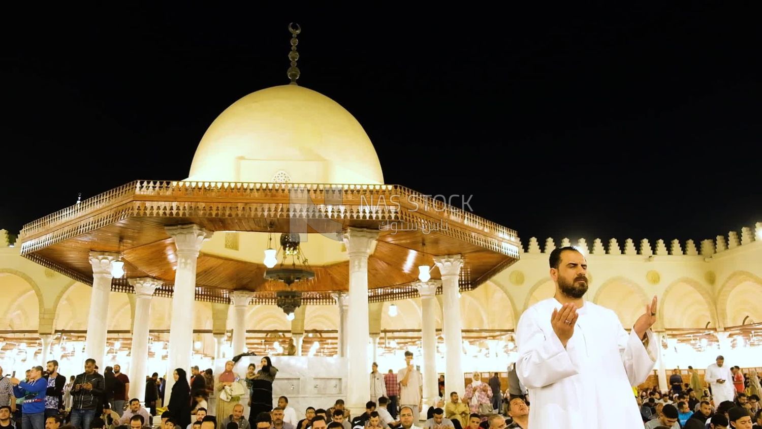 Man in the mosque, praying and crying to God, praying on the prayer rug, performing the obligatory prayer in the mosque, worship and draw close to God