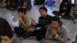 Worshipers praying in a mosque, performing the obligatory prayer in the mosque, worship and draw close to God