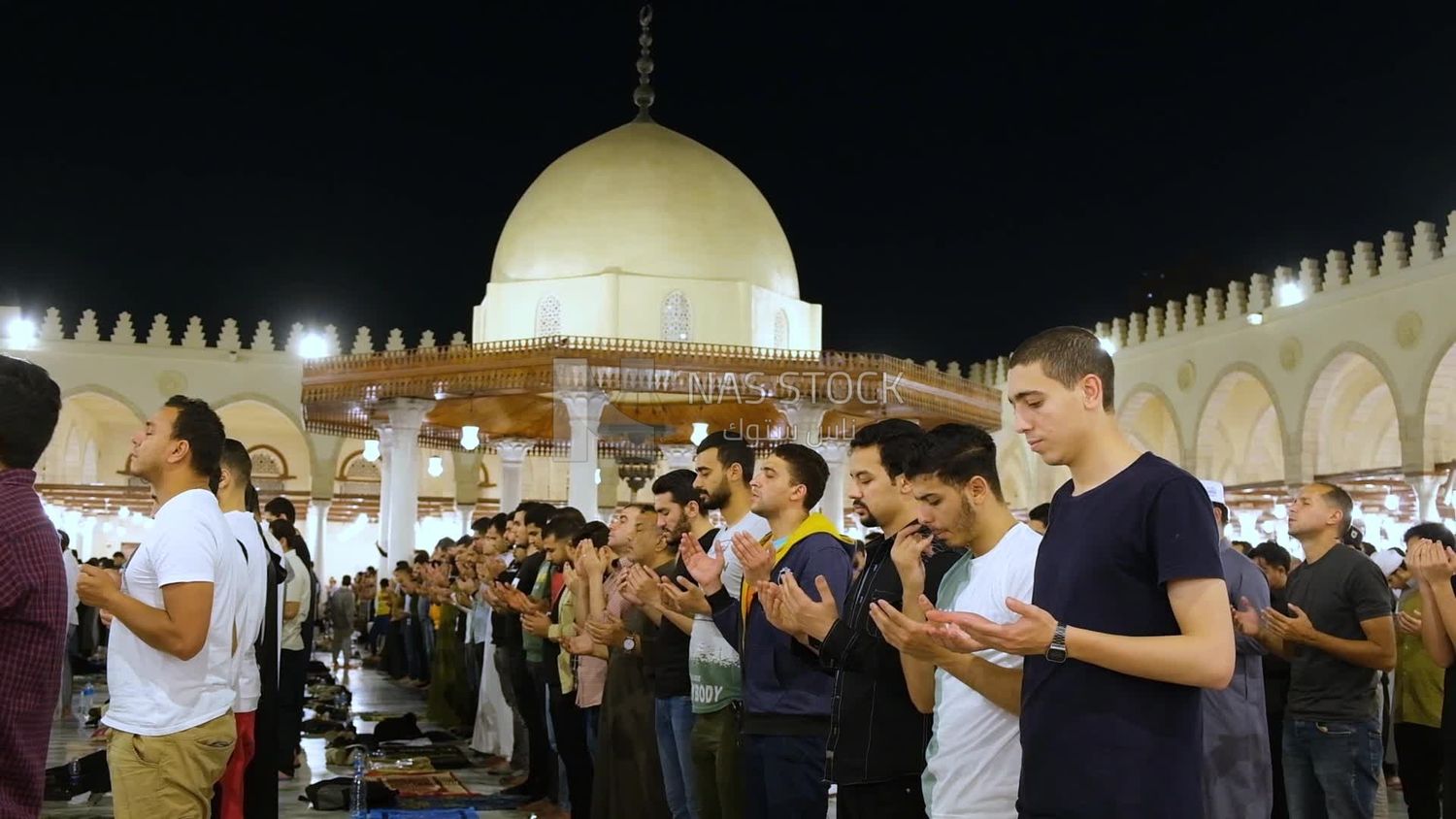 Worshipers praying in a mosque, performing the obligatory prayer in the mosque, worship and draw close to God