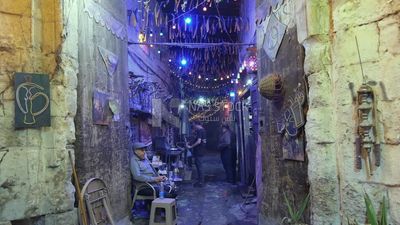 People sitting in a street coffee shop, Ramadan