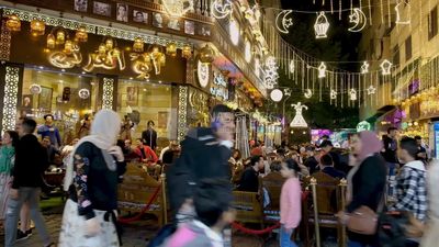 People sitting in a street coffee shop, Ramadan