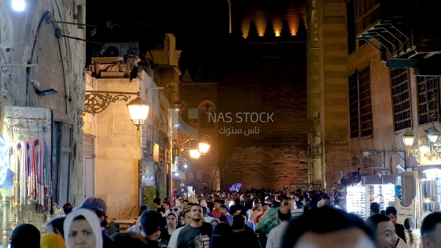 People on Al Moez Street at night, decoration lights