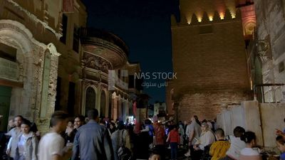 People on Al Moez Street at night, decoration lights